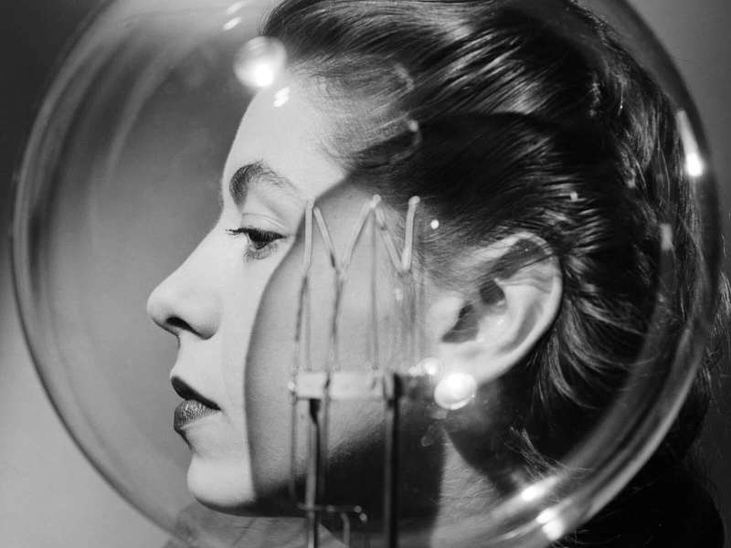 Lee Miller, Model with lightbulb, Vogue Studio, London, England, About 1943 | &copy; Lee Miller Archives, England 2024 / All rights reserved / leemiller.co.uk