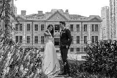 The groom and the bride with the Chamber of Commerce Shanghai background and The Bvlgari Hotel Shanghai