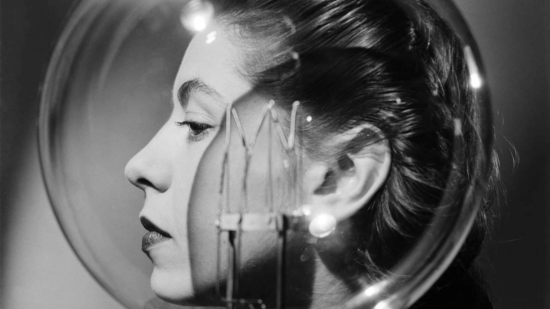 Lee Miller, Model with lightbulb, Vogue Studio, London, England, About 1943 | &copy; Lee Miller Archives, England 2024 / All rights reserved / leemiller.co.uk