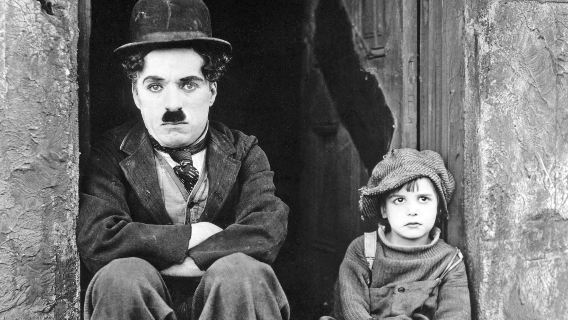Чарли чаплин дети. Чарли Чаплин. Чаплин 1921. Джеки Куган и Чарли Чаплин.